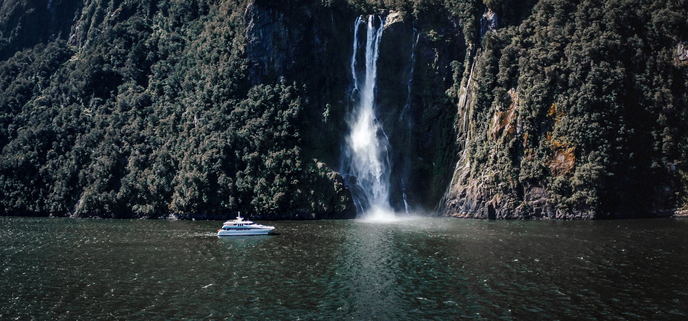 Gem of the Sound approaching Stirling Falls waterfall