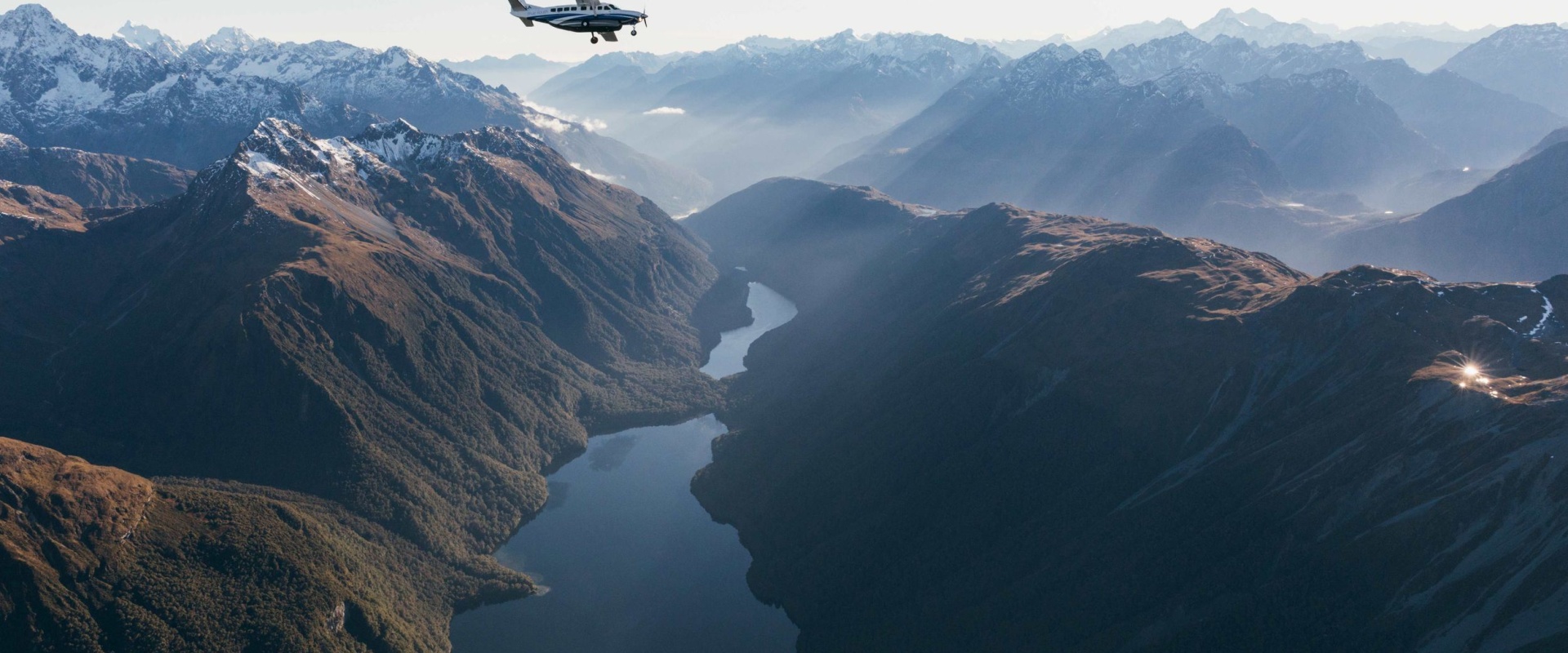 Scenic Flight into Piopiotahi Milford Sound travelling over stunning mountains and lakes 