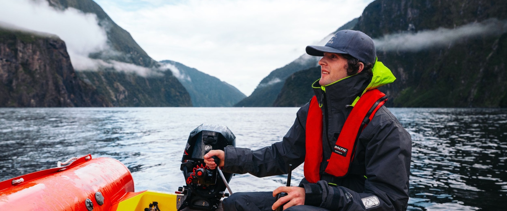Amazing views from the ''office'' as a crew member takes the tender (small rib) out in the fiord